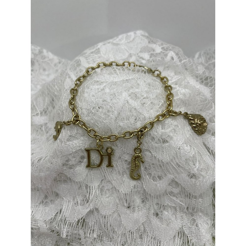 Di Gold Tone Charm Bracelet w/ 4 Charms